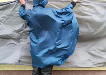 Flapping Around with a Light Background and Poncho in a Windstorm